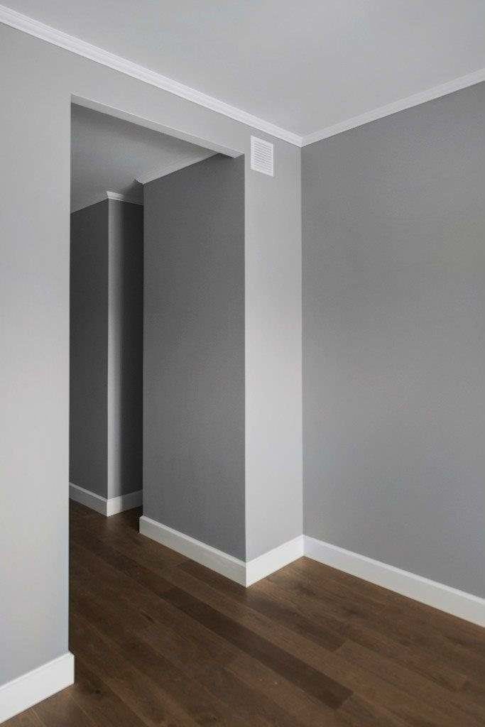 Clean painted baseboards and trim corner